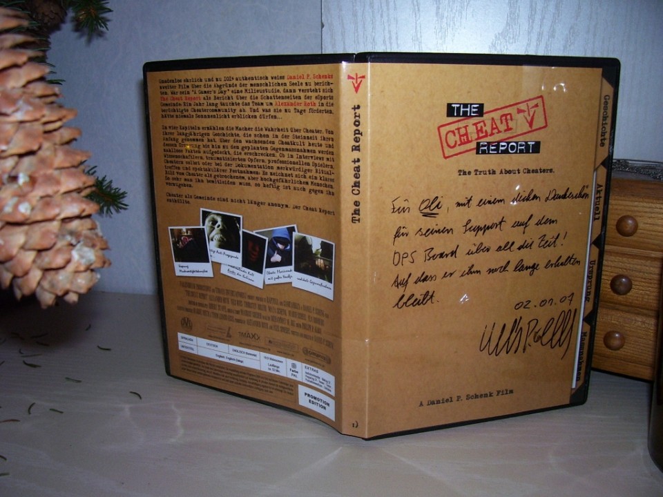 'The Cheat Report' by Daniel P. Schenk with a personal signature.